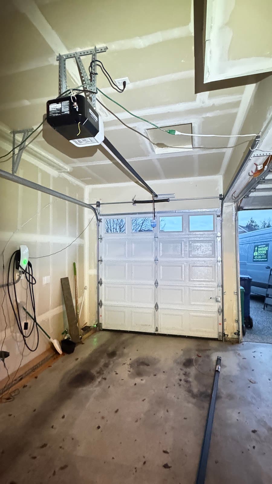 New garage door opener installed in residential garage